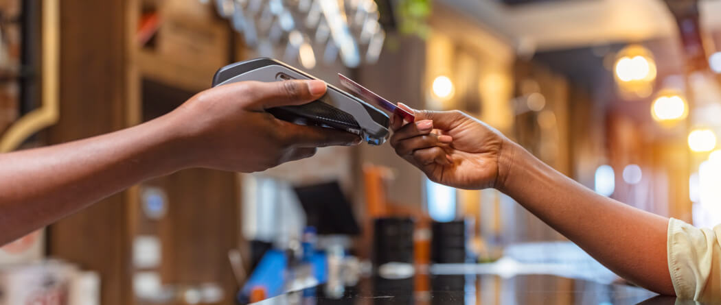 person paying with a debit or credit card