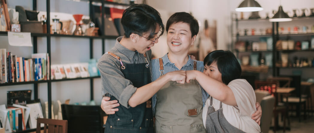 a family fist-bumping each other