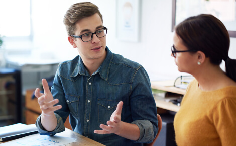 Coworkers talking in an office