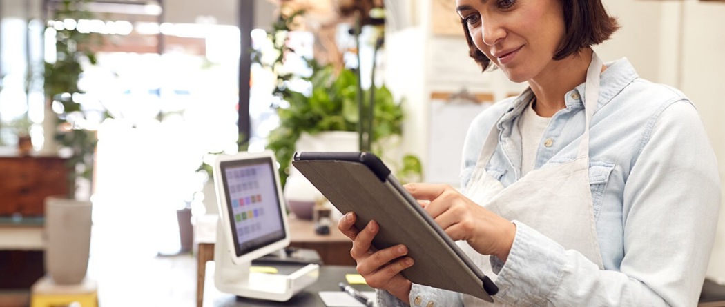 a woman looking at her tablet