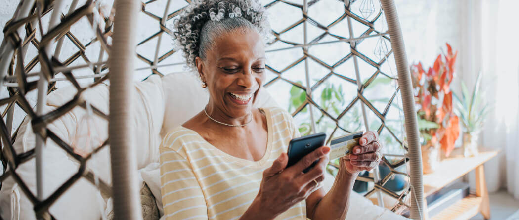 a mature woman looking at her mobile device
